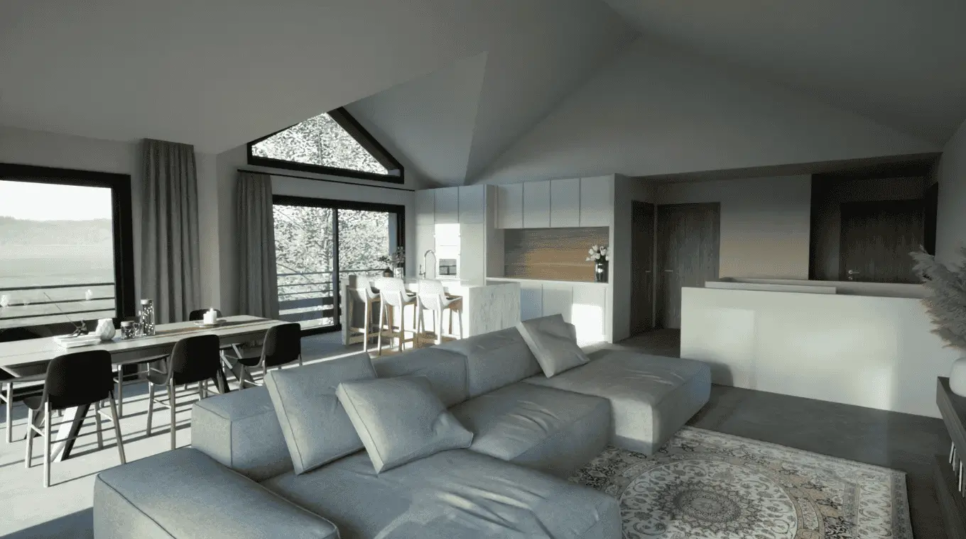 Pièce de vie avec canapé d’angle, coin repas et cuisine ouverte, baignée de lumière naturelle.